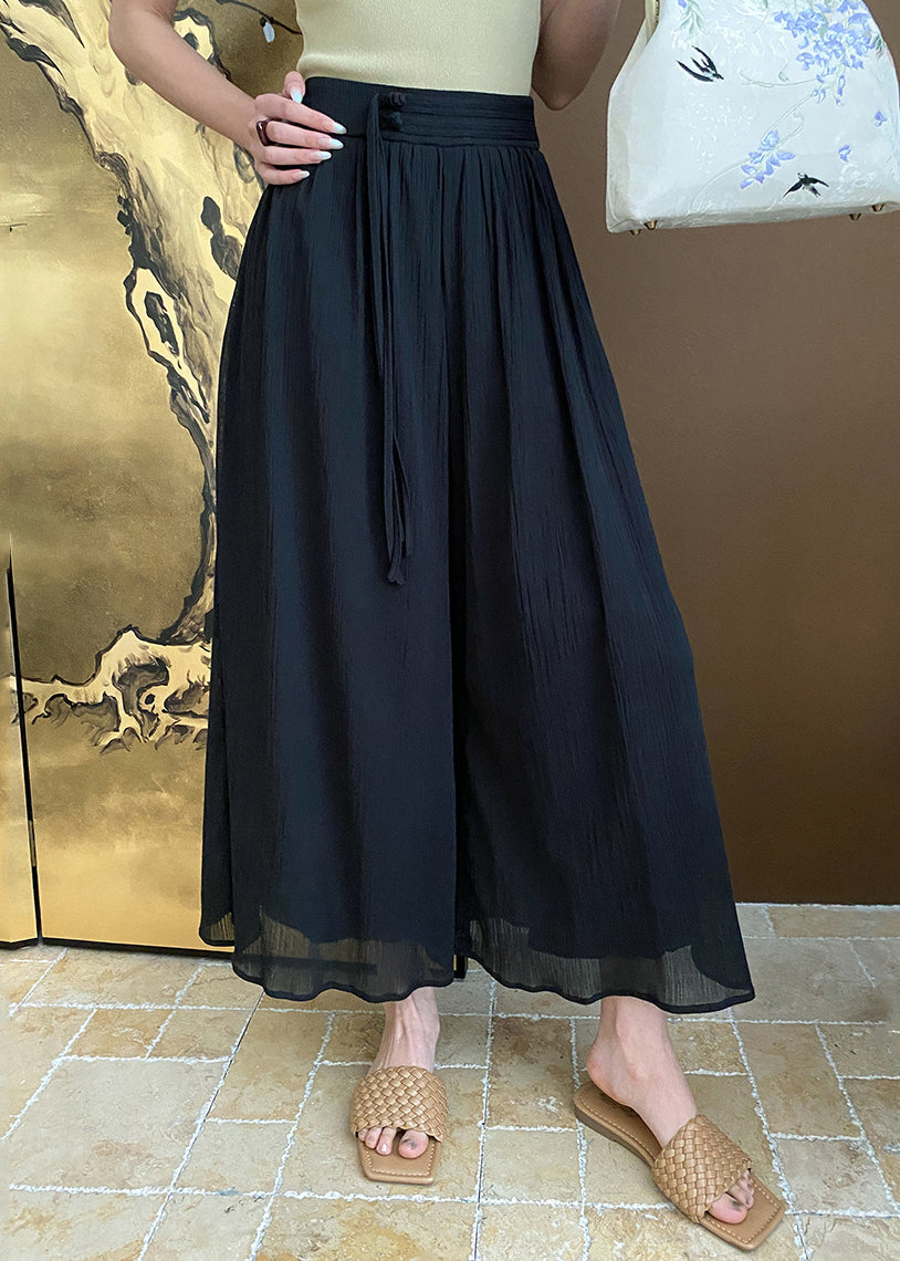 Schwarze Sommerhose aus Baumwolle mit weitem Bein und Reißverschlusstaschen AF1096