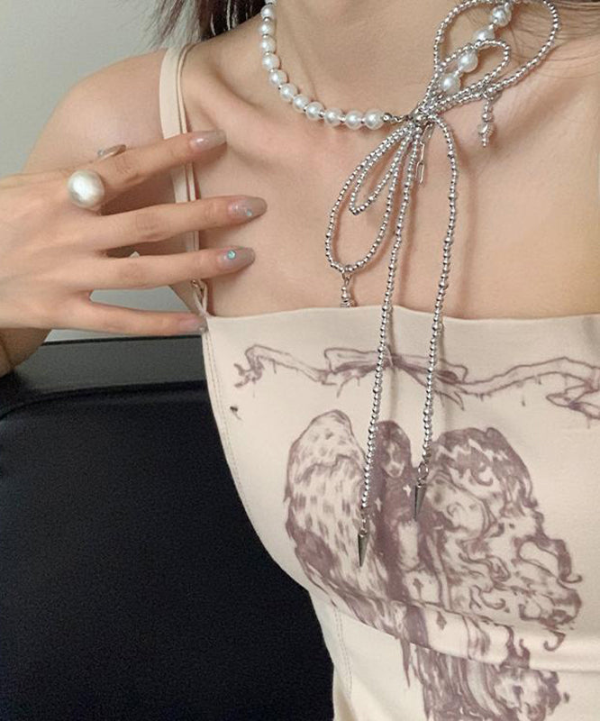 Collier avec pendentif en acier inoxydable et perles en forme de nœud papillon en soie Art Silk YA017