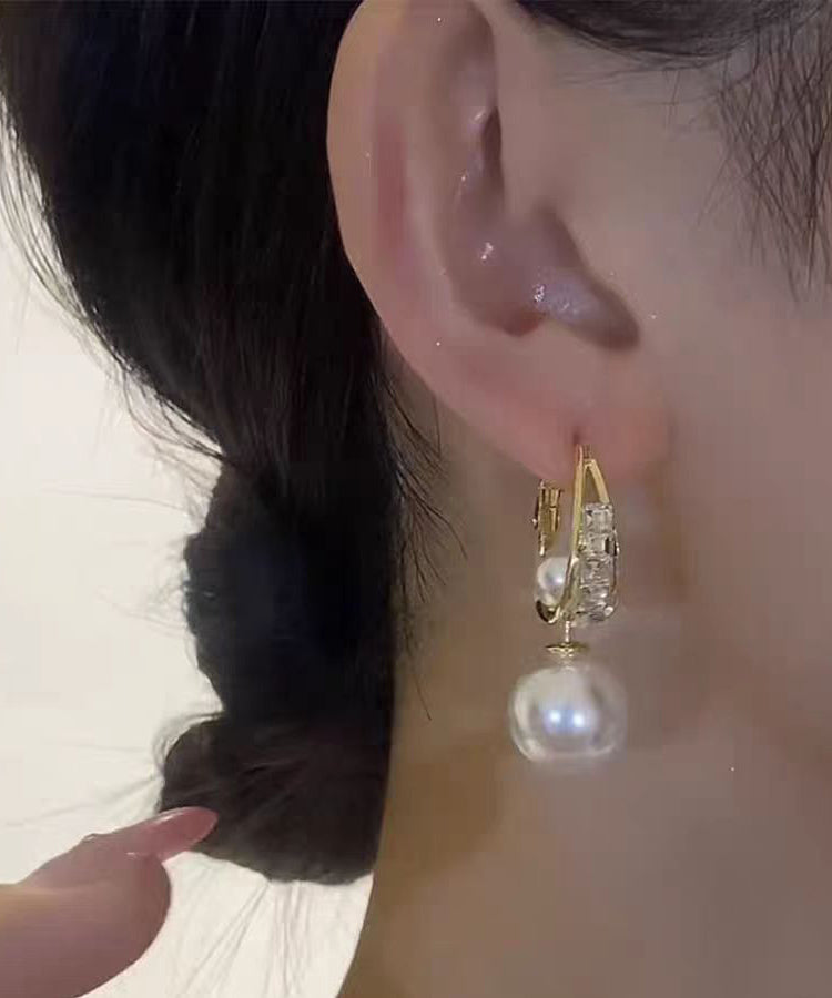 Neuartige Ohrringe mit vergoldetem Kupfer und Zirkonia in Tropfenform KX1038