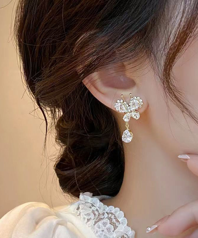 Boucles d'oreilles pendantes élégantes en alliage de cuivre blanc et zircon, motif papillon et pompon WH026