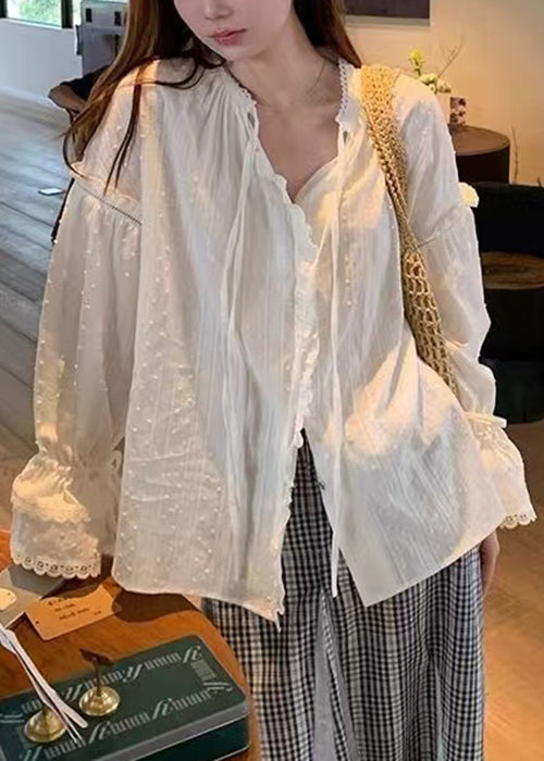 Chemise blanche évasée en coton à dentelle et manches amples à volants