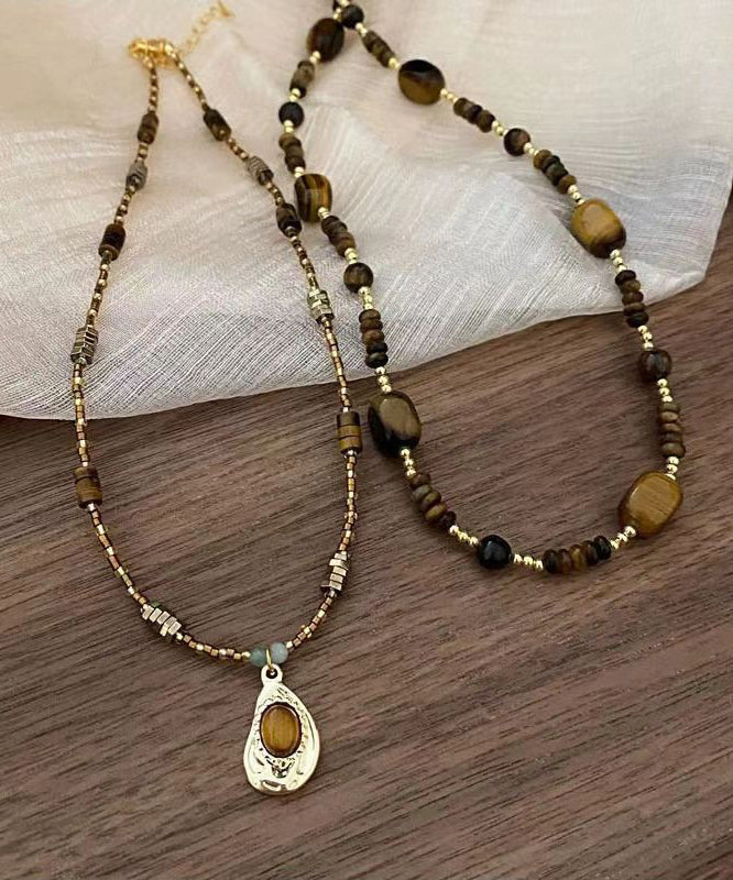 Collier rétro avec pendentif en œil de tigre et perles bicouches marron AB1069