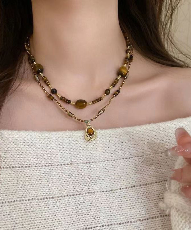 Collier rétro avec pendentif en œil de tigre et perles bicouches marron AB1069