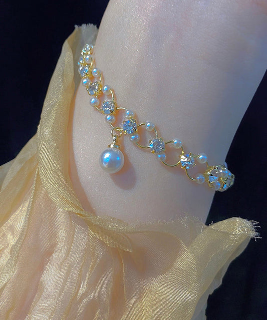 Stilvolles Charm-Armband aus Gold-Kupferlegierung mit Zirkonia-Perlen TX033