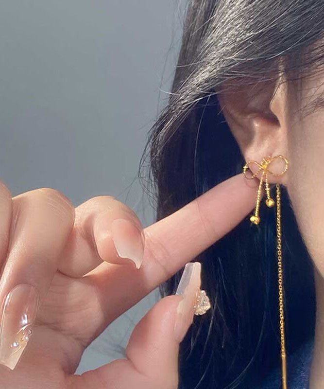 Boucles d'oreilles pendantes en argent sterling avec nœud en or