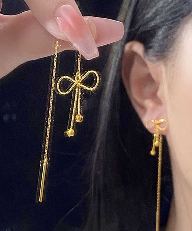 Boucles d'oreilles pendantes en argent sterling avec nœud en or