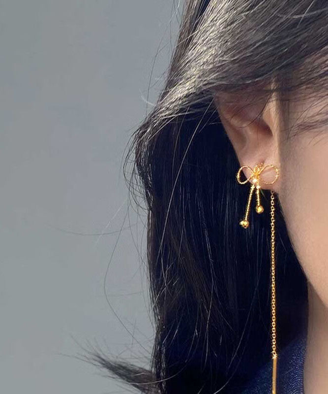 Boucles d'oreilles pendantes en argent sterling avec nœud en or