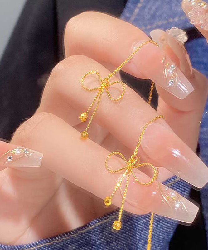 Boucles d'oreilles pendantes en argent sterling avec nœud en or