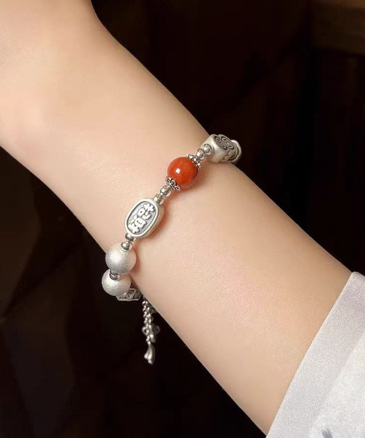 Bracelet à breloques en argent sterling et soie vintage avec pompon en agate DF1033